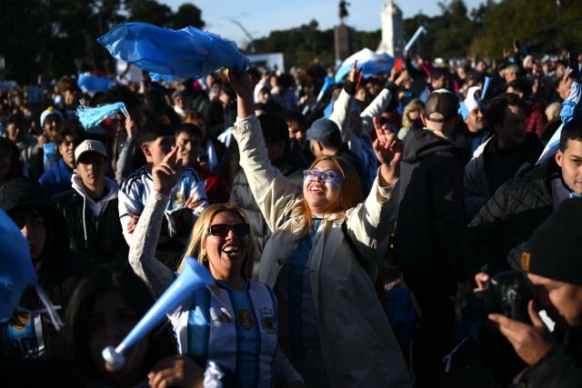 Argentina fans celebrate a goal scored by Argentina’s forward Lionel Messi as they watch the 2026 FIFA World Cup Group J football match between Argentina and Austria on a giant screen in Buenos Aires on June 22, 2026. (Photo by Luis ROBAYO / AFP)
