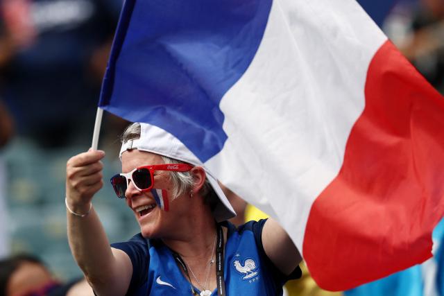A French fan waves a flag ahead of the 2026 World Cup Group I football match between France and Iraq at the Philadelphia Stadium in Philadelphia on June 22, 2026.  (Photo by FRANCK FIFE / AFP)