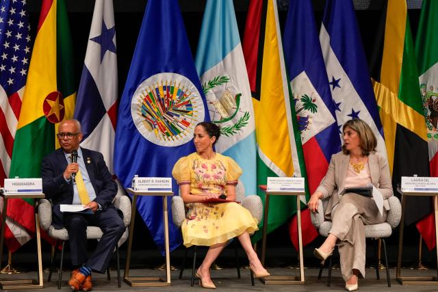 Secretary General of the Organization of American States (OAS) Albert Ramdin (L), Panama Culture Minister Maria Eugenia Herrera (C) and Assistant Secretary General of the OAS Laura Gil (R) attend a meeting with civil society representatives ahead of the 56th General Assembly of the OAS in Panama City on June 22, 2026. Panama is hosting the OAS General Assembly from June 24 to 26, bringing together foreign ministers, diplomats and representatives from across the Americas to discuss regional cooperation and key hemispheric issues. (Photo by ARNULFO FRANCO / AFP)