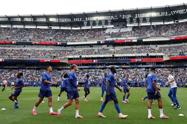 France's players take part in the warm-up ahead of the 2026 World Cup Group I football match between France and Iraq at the Philadelphia Stadium in Philadelphia on June 22, 2026.  (Photo by FRANCK FIFE / AFP)