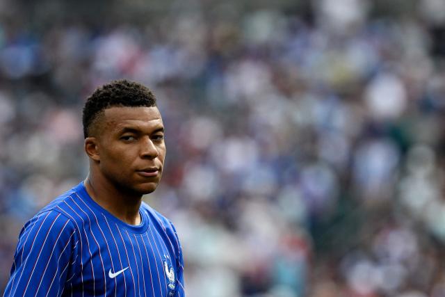 France's forward #10 Kylian Mbappe warms up ahead of the 2026 World Cup Group I football match between France and Iraq at the Philadelphia Stadium in Philadelphia on June 22, 2026.  (Photo by ROBERTO SCHMIDT / AFP)