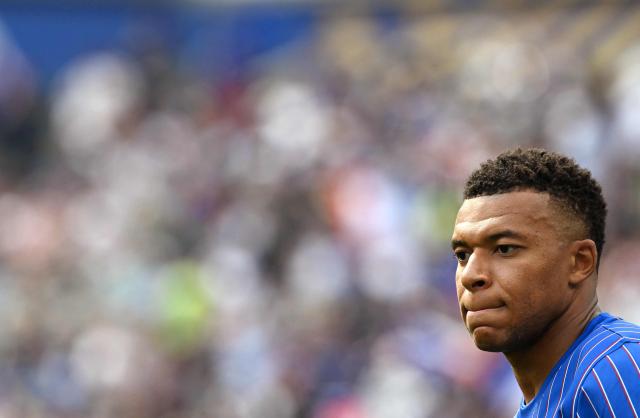 France's forward #10 Kylian Mbappe warms up ahead of the 2026 World Cup Group I football match between France and Iraq at the Philadelphia Stadium in Philadelphia on June 22, 2026.  (Photo by ROBERTO SCHMIDT / AFP)