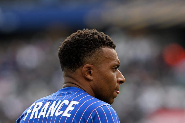 France's forward #10 Kylian Mbappe warms up ahead of the 2026 World Cup Group I football match between France and Iraq at the Philadelphia Stadium in Philadelphia on June 22, 2026.  (Photo by ROBERTO SCHMIDT / AFP)