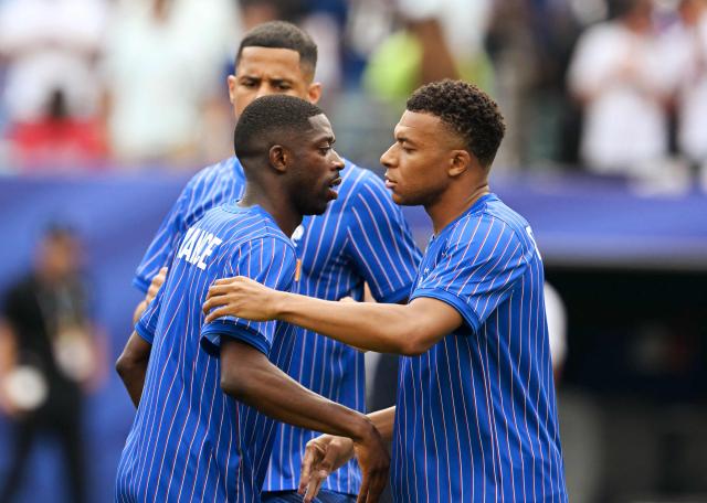 France's forward #07 Ousmane Dembele (L) and forward #10 Kylian Mbappe (R) warm up ahead of the 2026 World Cup Group I football match between France and Iraq at the Philadelphia Stadium in Philadelphia on June 22, 2026.  (Photo by ROBERTO SCHMIDT / AFP)