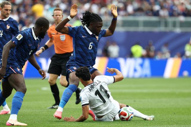 France's midfielder #06 Manu Kone and Iraq's forward #11 Ahmed Qasim fight for the ball during the 2026 World Cup Group I football match between France and Iraq at the Philadelphia Stadium in Philadelphia on June 22, 2026.  (Photo by FRANCK FIFE / AFP)