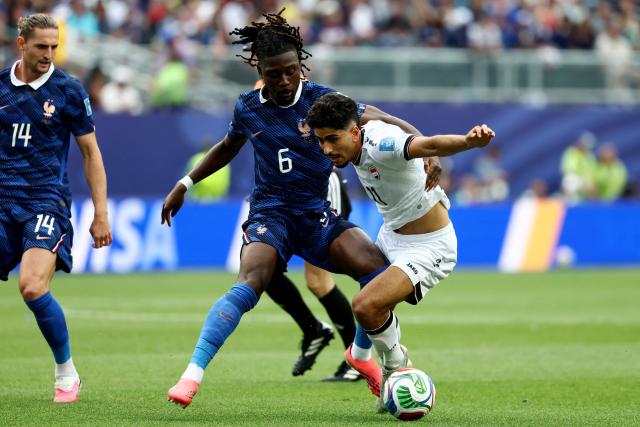 France's midfielder #06 Manu Kone and Iraq's forward #11 Ahmed Qasim fight for the ball during the 2026 World Cup Group I football match between France and Iraq at the Philadelphia Stadium in Philadelphia on June 22, 2026.  (Photo by FRANCK FIFE / AFP)
