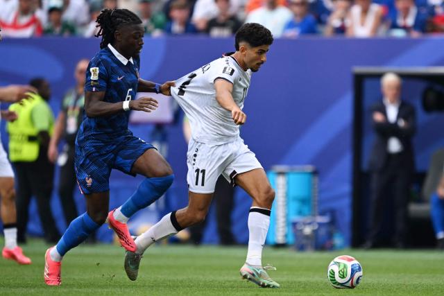 France's midfielder #06 Manu Kone and Iraq's forward #11 Ahmed Qasim fight for the ball during the 2026 World Cup Group I football match between France and Iraq at the Philadelphia Stadium in Philadelphia on June 22, 2026.  (Photo by ROBERTO SCHMIDT / AFP)