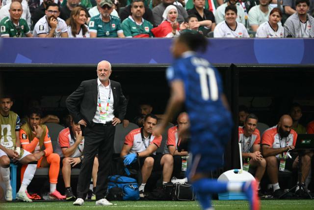 Iraq's Australian head coach Graham Arnold watches his players from the touchline during the 2026 World Cup Group I football match between France and Iraq at the Philadelphia Stadium in Philadelphia on June 22, 2026.  (Photo by MAURO PIMENTEL / AFP)