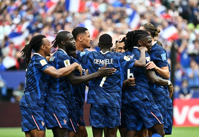 France's forward #10 Kylian Mbappe celebrates scoring his team's first goal with teammates during the 2026 World Cup Group I football match between France and Iraq at the Philadelphia Stadium in Philadelphia on June 22, 2026.  (Photo by Jewel SAMAD / AFP)