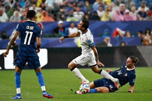 Iraq's midfielder #08 Ibrahim Bayesh and France's midfielder #14 Adrien Rabiot fight for the ball the 2026 World Cup Group I football match between France and Iraq at the Philadelphia Stadium in Philadelphia on June 22, 2026.  (Photo by Jewel SAMAD / AFP)