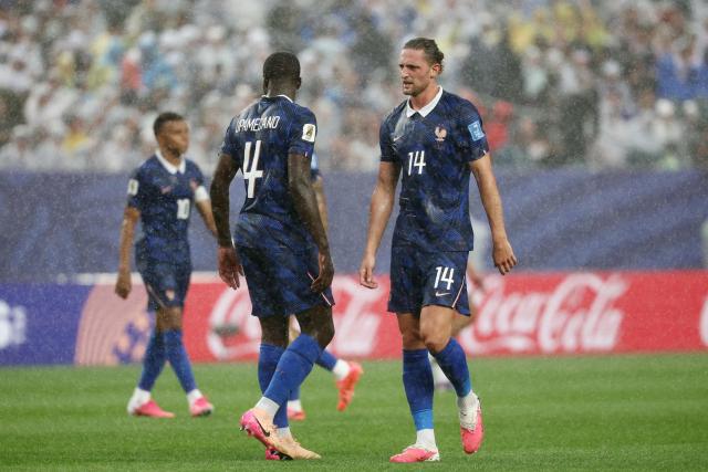 France's defender #04 Dayot Upamecano and midfielder #14 Adrien Rabiot react during the 2026 World Cup Group I football match between France and Iraq at the Philadelphia Stadium in Philadelphia on June 22, 2026.  (Photo by FRANCK FIFE / AFP)