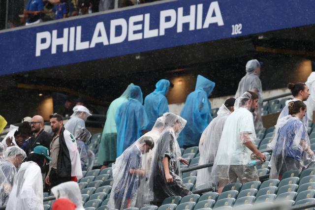 Fans wear raincoats at halftime of the 2026 World Cup Group I football match between France and Iraq at the Philadelphia Stadium in Philadelphia on June 22, 2026.  (Photo by FRANCK FIFE / AFP)