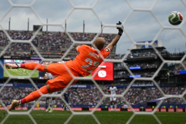 Iraq's goalkeeper #22 Ahmed Basil makes a save during during the 2026 World Cup Group I football match between France and Iraq at the Philadelphia Stadium in Philadelphia on June 22, 2026.  (Photo by Mauro PIMENTEL / AFP)