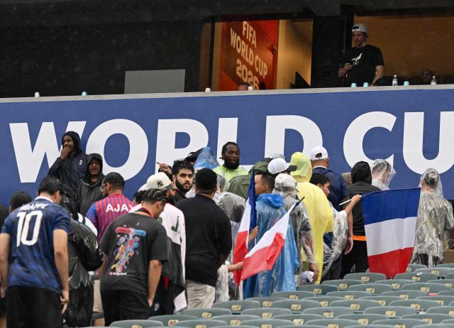 French fans leave the stands for a severe thunder storm warning during the 2026 World Cup Group I football match between France and Iraq at the Philadelphia Stadium in Philadelphia on June 22, 2026.  (Photo by ROBERTO SCHMIDT / AFP)