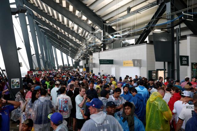 French and Iraqi fans await inside the stadium as the 2026 World Cup Group I football match between France and Iraq is suspended due to adverse weather at the Philadelphia Stadium in Philadelphia on June 22, 2026.  (Photo by FRANCK FIFE / AFP)