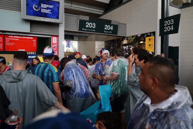 French and Iraqi fans await inside the stadium as the 2026 World Cup Group I football match between France and Iraq is suspended due to adverse weather at the Philadelphia Stadium in Philadelphia on June 22, 2026.  (Photo by FRANCK FIFE / AFP)