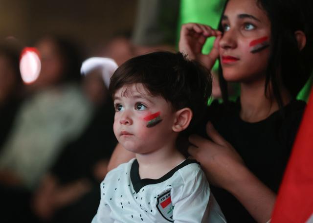 Iraqi fans react as they watch a live broadcast of the 2026 World Cup football match between France and Iraq in Baghdad, Iraq, on June 23, 2026. (Photo by Ahmad AL-RUBAYE / AFP)