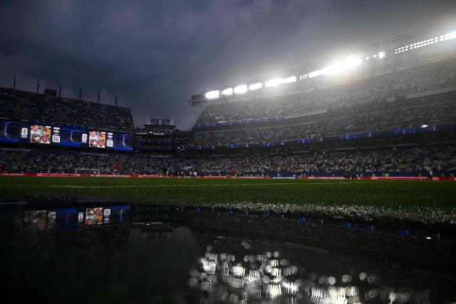 A puddle is pictured on the field as the 2026 World Cup Group I football match between France and Iraq is suspended due to adverse weather at the Philadelphia Stadium in Philadelphia on June 22, 2026.  (Photo by Jewel SAMAD / AFP)