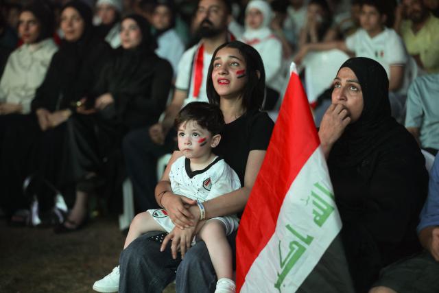 Iraqi fans react as they watch a live broadcast of the 2026 World Cup football match between France and Iraq in Baghdad, Iraq, on June 23, 2026. (Photo by Ahmad AL-RUBAYE / AFP)