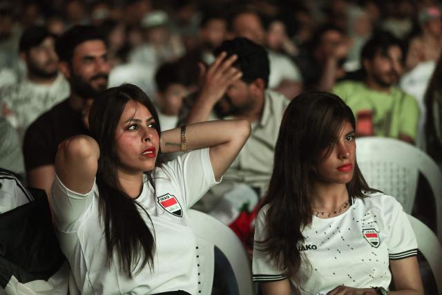 Iraqi fans react as they watch a live broadcast of the 2026 World Cup football match between France and Iraq in Baghdad, Iraq, on June 23, 2026. (Photo by Ahmad AL-RUBAYE / AFP)