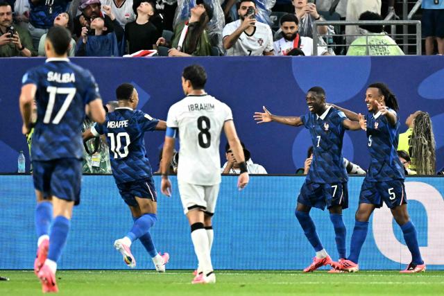 France's forward #07 Ousmane Dembele (2nd-R) celebrates scoring his team's third goal with teammates defender #05 Jules Kounde and forward #10 Kylian Mbappe during the 2026 World Cup Group I football match between France and Iraq at the Philadelphia Stadium in Philadelphia on June 22, 2026.  (Photo by Jewel SAMAD / AFP)