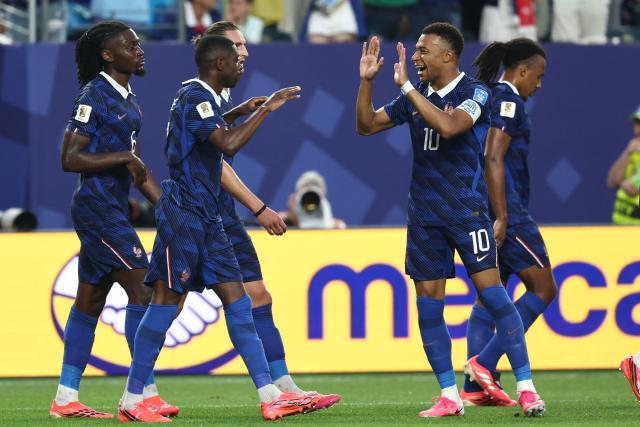France's forward #07 Ousmane Dembele (2nd-L) celebrates scoring his team's third goal with teammate forward #10 Kylian Mbappe during the 2026 World Cup Group I football match between France and Iraq at the Philadelphia Stadium in Philadelphia on June 22, 2026.  (Photo by FRANCK FIFE / AFP)