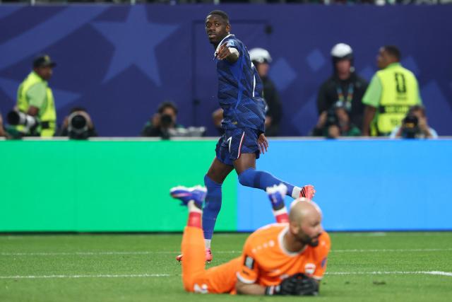 France's forward #07 Ousmane Dembele celebrates scoring his team's third goal past Iraq's goalkeeper #22 Ahmed Basil during the 2026 World Cup Group I football match between France and Iraq at the Philadelphia Stadium in Philadelphia on June 22, 2026.  (Photo by FRANCK FIFE / AFP)