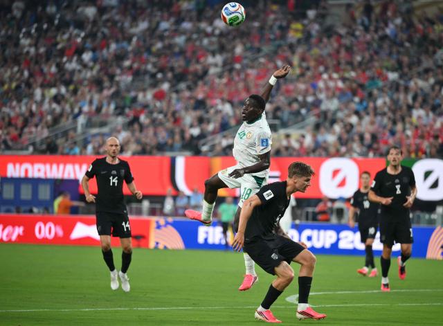 Senegal's forward #18 Ismaila Sarr and Norway's defender #05 David Moller Wolfe fight for the ball during the 2026 World Cup Group I football match between Norway and Senegal at the New York/New Jersey Stadium in East Rutherford on June 22, 2026. (Photo by Angela WEISS / AFP)