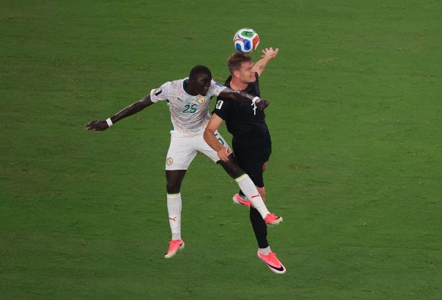 Senegal's defender #25 El Hadji Malick Diouf and Norway's forward #07 Alexander Sorloth  fight for the ball during the 2026 World Cup Group I football match between Norway and Senegal at the New York/New Jersey Stadium in East Rutherford on June 22, 2026. (Photo by Timothy A. CLARY / AFP)