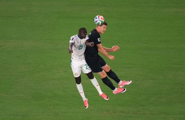 Senegal's defender #25 El Hadji Malick Diouf and Norway's forward #07 Alexander Sorloth fight for the ball during the 2026 World Cup Group I football match between Norway and Senegal at the New York/New Jersey Stadium in East Rutherford on June 22, 2026. (Photo by Timothy A. CLARY / AFP)