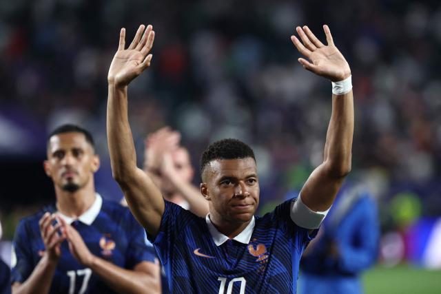 France's forward #10 Kylian Mbappe celebrates with fans after winning the 2026 World Cup Group I football match between France and Iraq at the Philadelphia Stadium in Philadelphia on June 22, 2026.  (Photo by FRANCK FIFE / AFP)