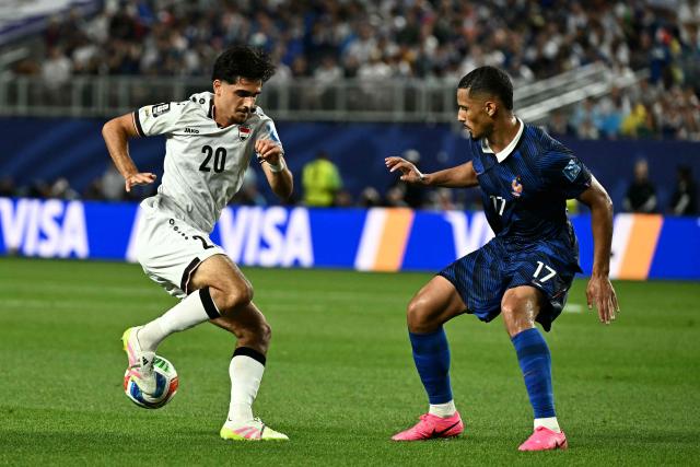 Iraq's midfielder #20 Aimar Sher controls the ball past France's defender #17 William Saliba during the 2026 World Cup Group I football match between France and Iraq at the Philadelphia Stadium in Philadelphia on June 22, 2026.  (Photo by Jewel SAMAD / AFP)