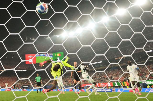 “Senegal’s goalkeeper #16 Edouard Mendy concedes a goal as Norway’s forward #09 Erling Braut Haaland (C) scores his team’s third goal during the 2026 World Cup Group I football match between Norway and Senegal at the New York/New Jersey Stadium in East Rutherford on June 22, 2026. (Photo by Angela WEISS / AFP)