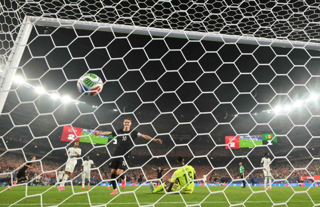 Norway's midfielder #10 Martin Odegaard celebrates as forward #09 Erling Braut Haaland (out of frame) scores his team’s third goal during the 2026 World Cup Group I football match between Norway and Senegal at the New York/New Jersey Stadium in East Rutherford on June 22, 2026. (Photo by Angela WEISS / AFP)
