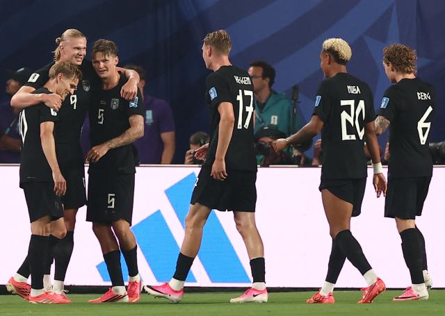 Norway's forward #09 Erling Braut Haaland (2nd L) celebrates scoring his team's third goal with teammates during the 2026 World Cup Group I football match between Norway and Senegal at the New York/New Jersey Stadium in East Rutherford on June 22, 2026. (Photo by Charly TRIBALLEAU / AFP)