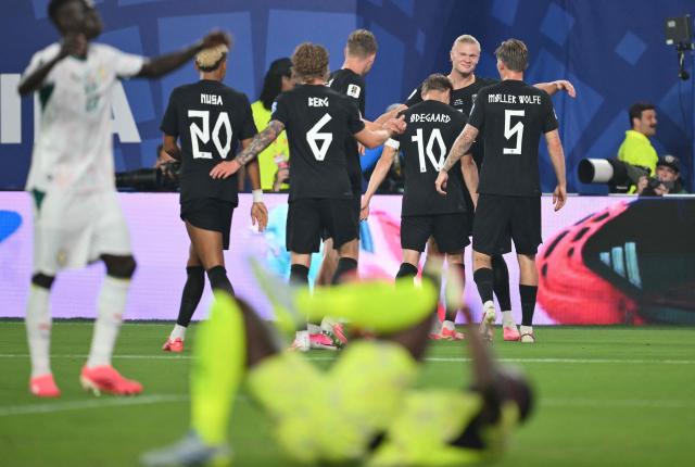 Norway's forward #09 Erling Braut Haaland (C) scores his team's third goal with teammates during the 2026 World Cup Group I football match between Norway and Senegal at the New York/New Jersey Stadium in East Rutherford on June 22, 2026. (Photo by Angela WEISS / AFP)