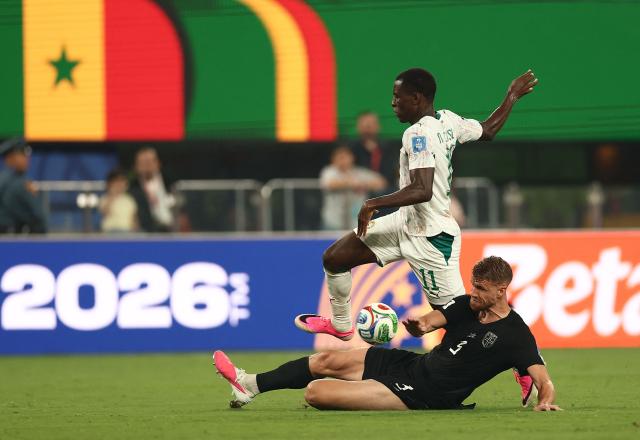 Senegal's forward #11 Nicolas Jackson and Norway's defender #03 Kristoffer Vassbakk Ajerfight for the ball during the 2026 World Cup Group I football match between Norway and Senegal at the New York/New Jersey Stadium in East Rutherford on June 22, 2026.  (Photo by Charly TRIBALLEAU / AFP)