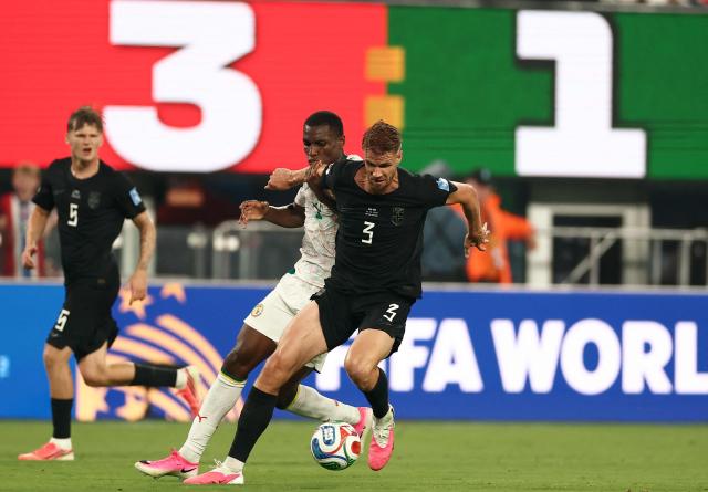 Senegal's forward #11 Nicolas Jackson and Norway's defender #03 Kristoffer Vassbakk Ajer fight for the ball during the 2026 World Cup Group I football match between Norway and Senegal at the New York/New Jersey Stadium in East Rutherford on June 22, 2026.  (Photo by Charly TRIBALLEAU / AFP)