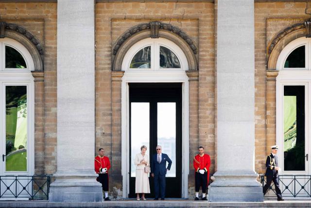 King Philippe - Filip of Belgium (centre R) and Queen Mathilde of Belgium stand at the Castle of Laeken in Brussels during the official state visit of the Japanese Emperor and Empress to Belgium, on June 22, 2026. (Photo by BENOIT DOPPAGNE / Belga / AFP) / Belgium OUT