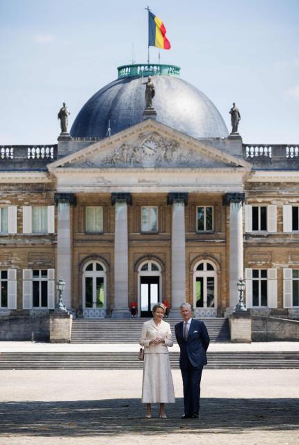 King Philippe - Filip of Belgium (R) and Queen Mathilde of Belgium stand at the Castle of Laeken in Brussels during the official state visit of the Japanese Emperor and Empress to Belgium, on June 22, 2026. (Photo by BENOIT DOPPAGNE / Belga / AFP) / Belgium OUT