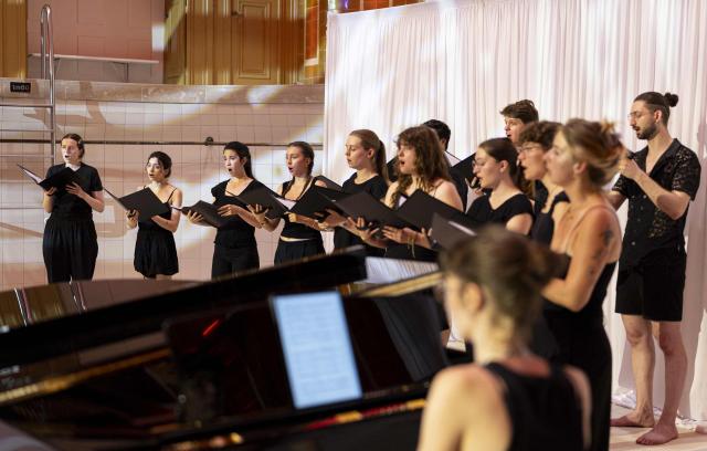Members of the Choeur de l'Orchestre du Rhin perform during a dress rehearsal at the Bains Municipaux, a public bathing site with the historical monument status, in Strasbourg, eastern France, on June 22, 2026. (Photo by ROMEO BOETZLE / AFP)