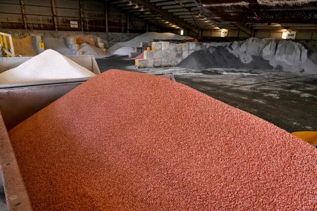 A photo taken on June 22, 2026 shows Muriate of Potash fertiliser in a hopper at a fertiliser depot in the small rural town of Buffalo, some 163kms south-west of Melbourne. Importing 90 percent of fertilisers, Australia is facing a severe shortage due to the closure of the Strait of Hormuz. (Photo by William WEST / AFP)