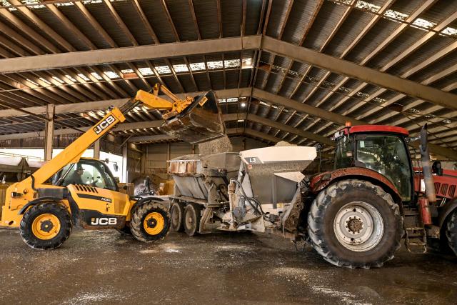 A photo taken on June 22, 2026 shows a farmer loading fertiliser into a spreader at a fertiliser depot in the small rural town of Buffalo, some 163kms south-west of Melbourne. Importing 90 percent of fertilisers, Australia is facing a severe shortage due to the closure of the Strait of Hormuz. (Photo by William WEST / AFP)