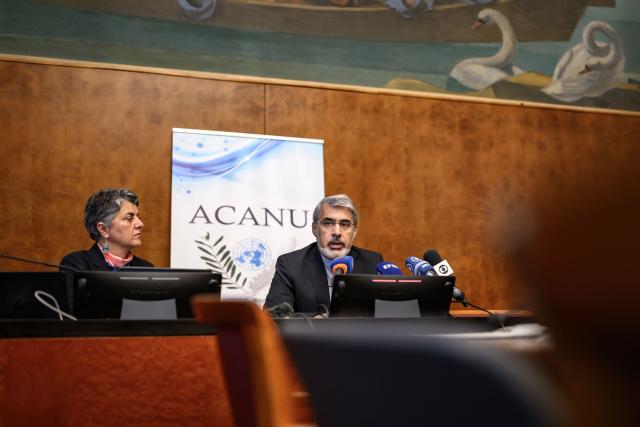 Iranian ambassador to the United Nations in Geneva Ali Bahreini (R) speaks next to ACANU president Dina Abi Saab during a briefing with the UN correspondent's association ACANU, following talks between US and Iran in Switzerland, in Geneva, on June 23, 2026. (Photo by Fabrice COFFRINI / AFP)