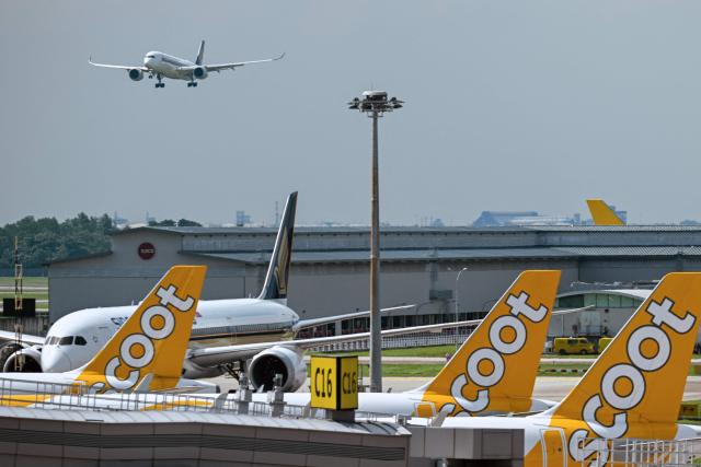 A Singapore Airlines Airbus A350 passenger aicraft makes its final approach for landing at Singapore Changi Airport in Singapore on June 23, 2026. (Photo by Roslan RAHMAN / AFP)
