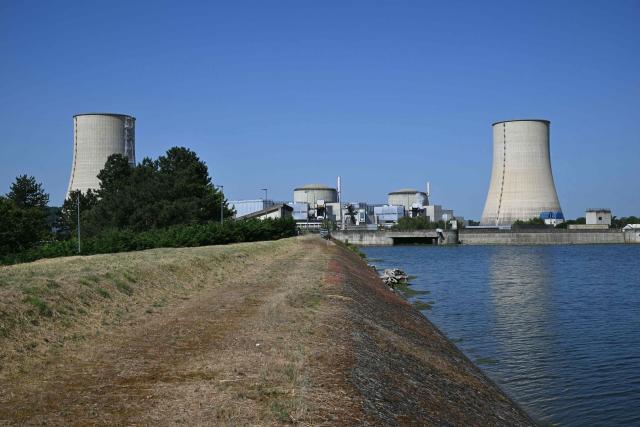 Tis photograph shows a view of the stopped Golfech nuclear power plant in southwestern France is pictured after its shutdown  on June 22 evening, due to "environmental constraints" related to an ongoing heatwave, on June 23, 2026 in Golfech. In periods of extreme heat, rising river temperatures can force EDF to reduce, or even halt, its production in order to avoid further warming the waterways. The operation of the plants is governed by maximum heating thresholds for bodies of water, which must not be exceeded, in order to protect wildlife and plant life. (Photo by Lionel BONAVENTURE / AFP)