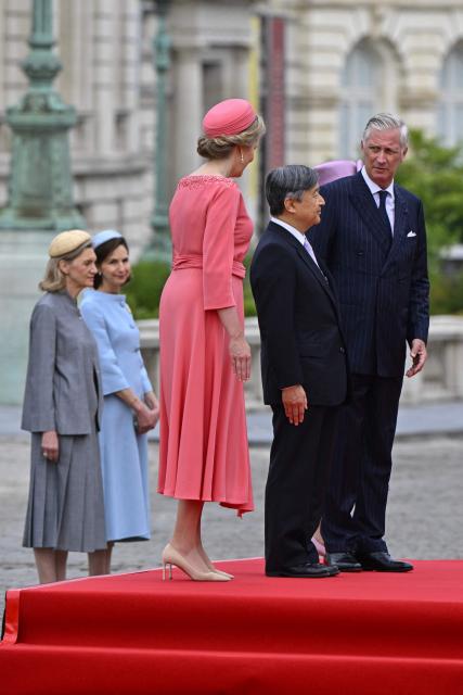 LtoR, Queen Mathilde of Belgium, Japan's Emperor Naruhito and King Philippe - Filip of Belgium - pose during an official ceremony at the Palaces square (Place des Palais) during an official state visit, in Brussels on June 23, 2026. (Photo by ERIC LALMAND / Belga / AFP) / Belgium OUT