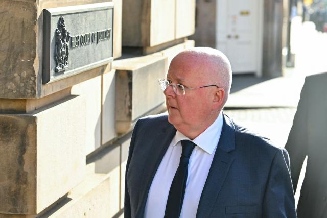 (FILES) Peter Murrell, former CEO for the Scottish National Party (SNP), arrives to attend a preliminary hearing on accusations of embezzlement, at the High Court in Edinburgh, Scotland on May 25, 2026. The ex-husband of Scotland's former first minister Nicola Sturgeon was jailed for five years and three months on June 23, 2026, for embezzling more than £400,000 ($529,000) from the pro-independence Scottish National Party. (Photo by ANDY BUCHANAN / AFP)