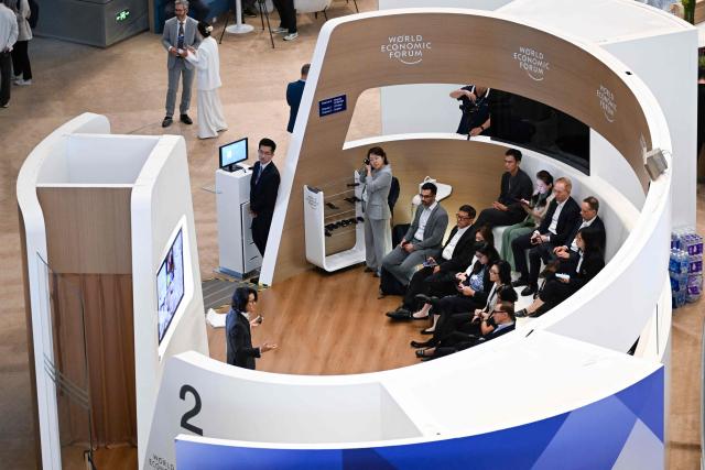 Participants attend a seminar group at the Dalian International Conference Centre during the World Economic Forum Annual Meeting of the New Champions in Dalian, China's Liaoning province on June 23, 2026. (Photo by WANG Zhao / AFP)