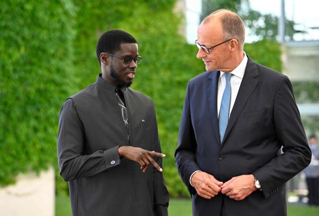 German Chancellor Friedrich Merz (R) welcomes Senegal's President Bassirou Diomaye Faye at the Chancellery in Berlin on June 23, 2026. (Photo by Tobias SCHWARZ / AFP)
